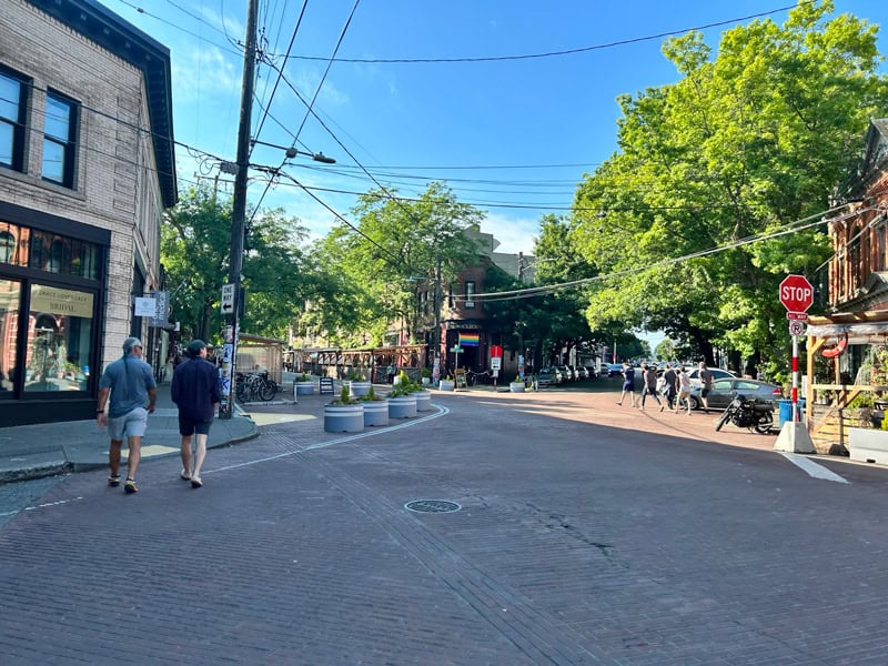 A streetscape with pedestrians.